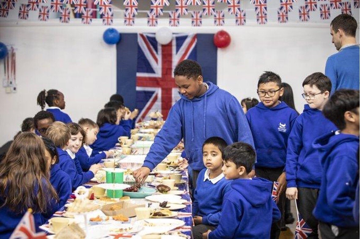 Meal at school with flag behind