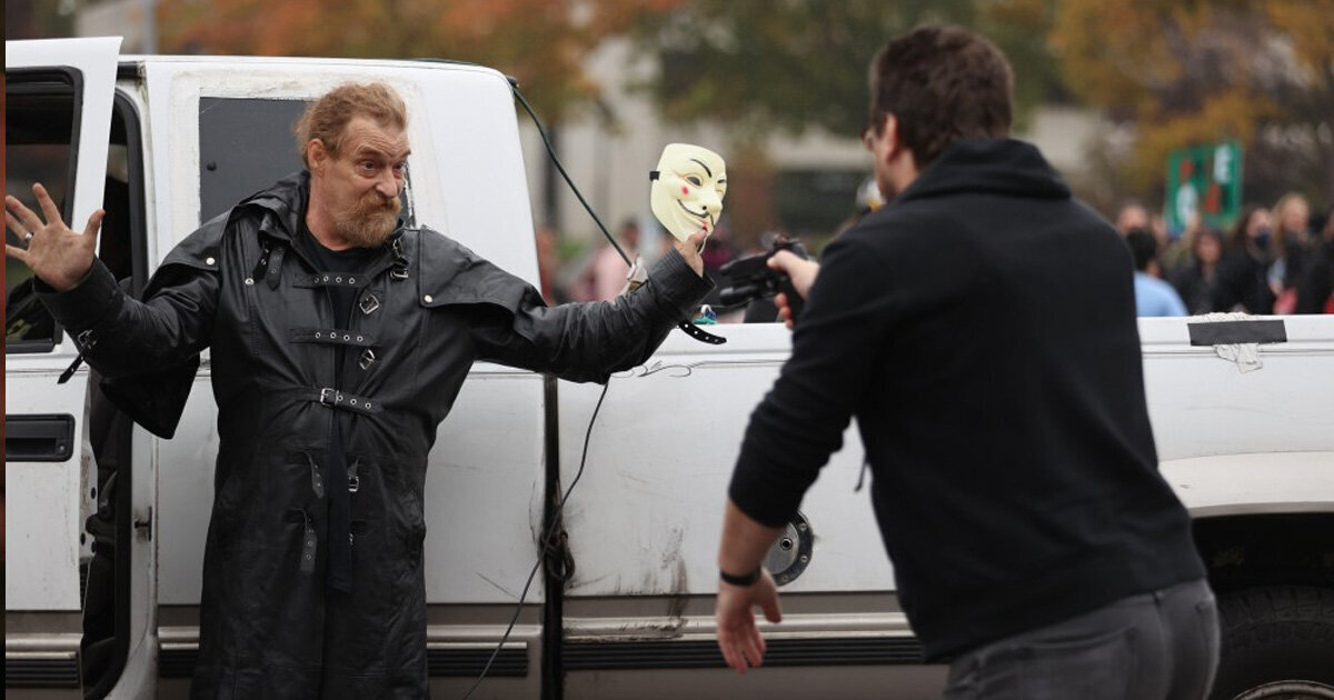 Violent Counter Protestor Detained At Gunpoint By Armed Citizens