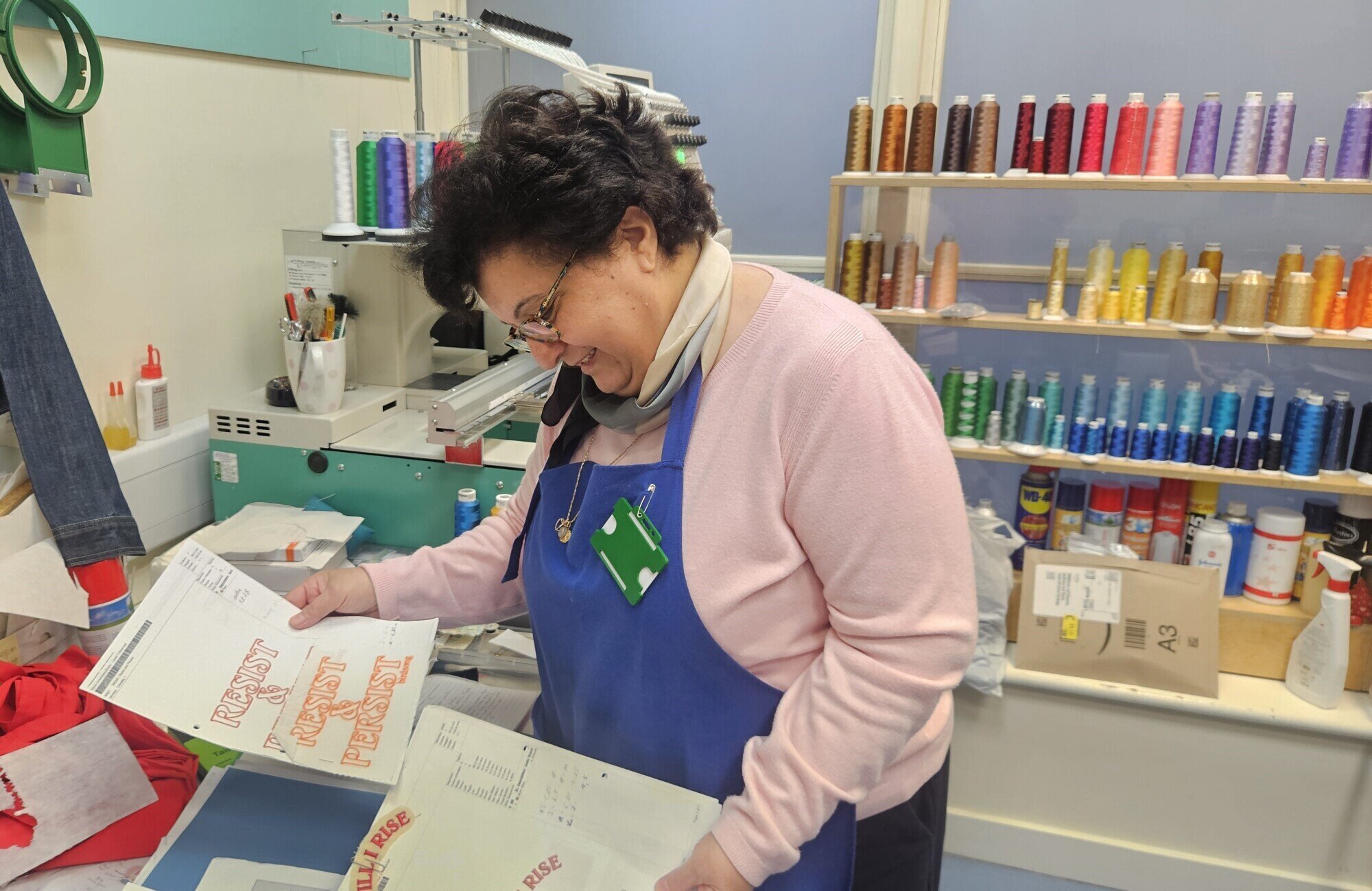 Image of a model wearing a Birdsong dress, with the words "Dress in Protest" above